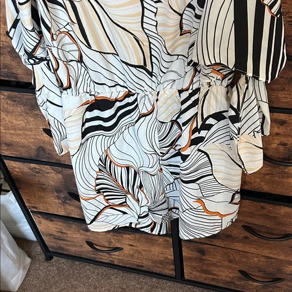 Adelyn Rae Black and Orange Patterned Romper - Picture 9 of 9